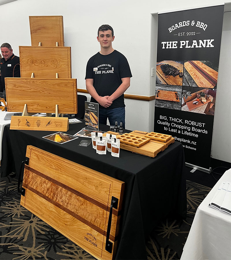 Jacob serving a customer at the The Plank™ at the Taranaki Chamber of Commerce business showcase